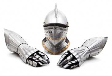 The helmet from a suit of armour with a pair of gauntlets. The helmet from a suit of armour with a pair of gauntlets.