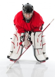 A man wearing hockey gear. A man wearing hockey gear.