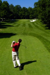 A man playing golf. A man playing golf.