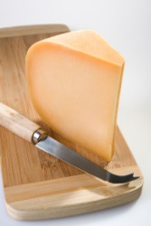 A wedge of Gouda. A wedge of Gouda.