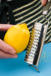 Grating a lemon. Grating a lemon.