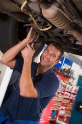 A grease monkey at work. A grease monkey at work.