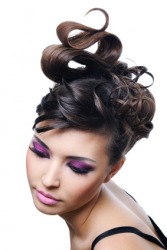 A woman with an elaborate hairdo. A woman with an elaborate hairdo.