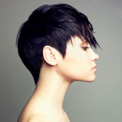 A woman with a short hairstyle. A woman with a short hairstyle.