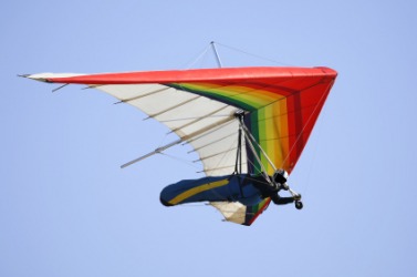A person hang-gliding. A person hang-gliding.