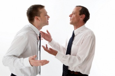 A head-to-head confrontation between two businessmen. A head-to-head confrontation between two businessmen.