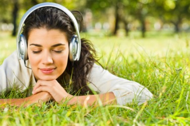 A woman wearing a set of headphones. A woman wearing a set of headphones.