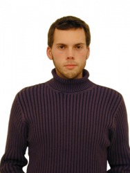 A man wearing a high-necked sweater. A man wearing a high-necked sweater.