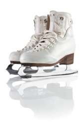 A pair of white ice skates. A pair of white ice skates.