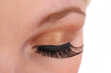A woman wearing imitation eyelashes. A woman wearing imitation eyelashes.