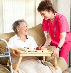 A woman receives in-home nursing care. A woman receives in-home nursing care.