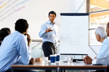 A businessman gives an informative lecture. A businessman gives an informative lecture.