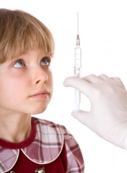 A little girl about to receive an inoculation. A little girl about to receive an inoculation.