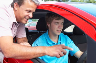 A driving instructor with his student. A driving instructor with his student.