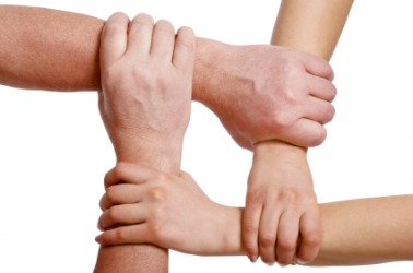 Interlocking hands. Interlocking hands.