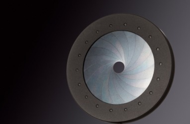 An iris diaphragm on a camera lens. An iris diaphragm on a camera lens.