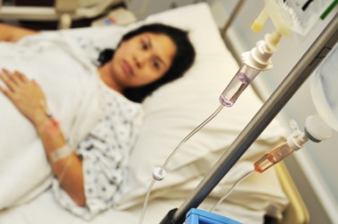 A woman with an IV. A woman with an IV.