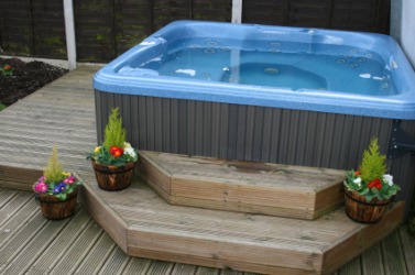 A Jacuzzi on a deck. A Jacuzzi on a deck.