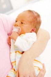 A newborn baby with jaundice. A newborn baby with jaundice.
