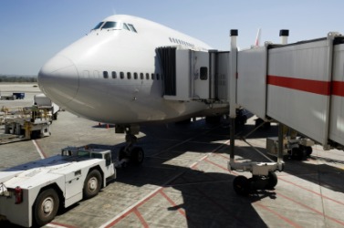 A Jetway attached to a plane. A Jetway attached to a plane.