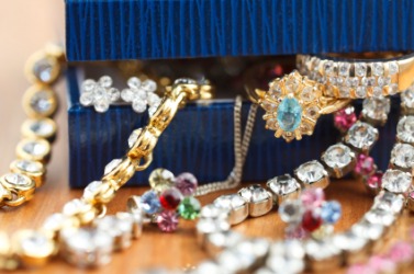 A box overflowing with jewelry. A box overflowing with jewelry.