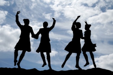 A group of people dancing a jig. A group of people dancing a jig.