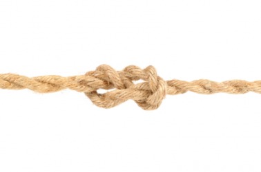 A piece of knotted jute rope. A piece of knotted jute rope.