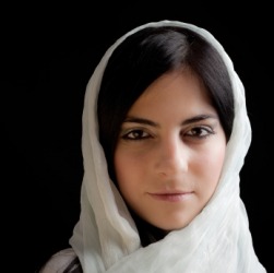 A young woman wearing a white kerchief. A young woman wearing a white kerchief.