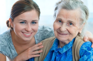 An elderly woman with her kindhearted caregiver. An elderly woman with her kindhearted caregiver.