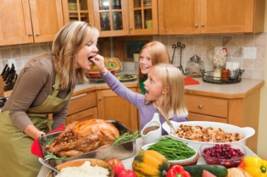 Mother and daughters cooking in the kitchen. Mother and daughters cooking in the kitchen.