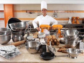 A chef with his kitchenware. A chef with his kitchenware.