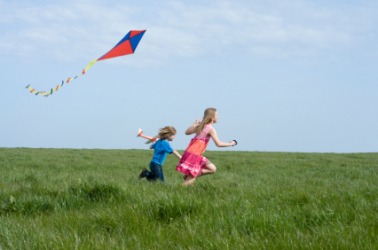 Two children flying a kite. Two children flying a kite.