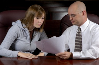 A lawyer talks with his client. A lawyer talks with his client.