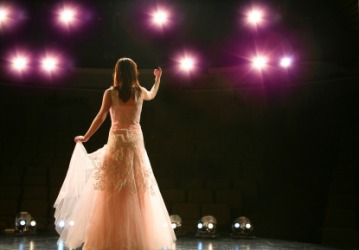 The lead actress on stage. The lead actress on stage.