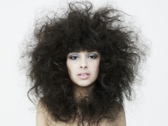 This womans hair could be described as leonine. This womans hair could be described as leonine.