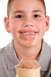 This boy likes his ice cream. This boy likes his ice cream.