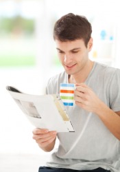 A man reading a magazine. A man reading a magazine.