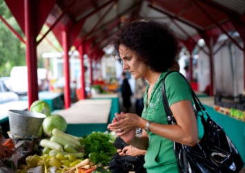 A woman shopping at a local marketplace. A woman shopping at a local marketplace.
