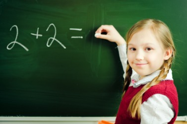 A little girl learning basic math. A little girl learning basic math.