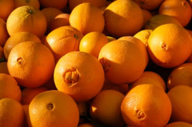 A pile of navel oranges. A pile of navel oranges.