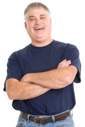 A man wearing a navy blue shirt. A man wearing a navy blue shirt.
