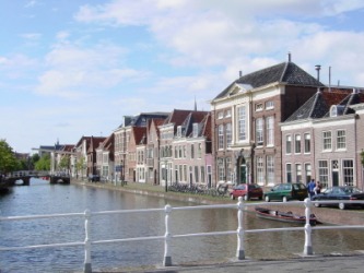 Homes and a canal in Alkmaar in The Netherlands. Homes and a canal in Alkmaar in The Netherlands.