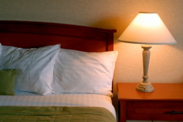 A lamp on a night table. A lamp on a night table.