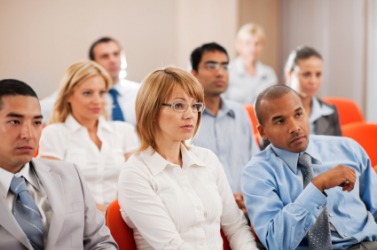 A group of observers at a seminar. A group of observers at a seminar.