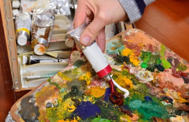 An artist using oil colors. An artist using oil colors.