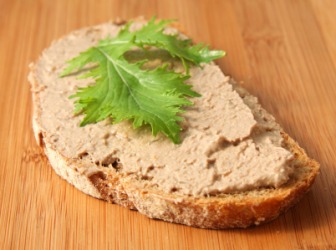 Pate spread on a slice of bread. Pate spread on a slice of bread.