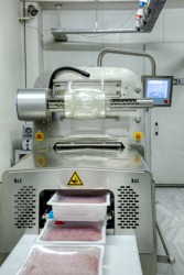 A machine used in the process of meat packing. A machine used in the process of meat packing.