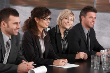 A group participating in a panel discussion. A group participating in a panel discussion.