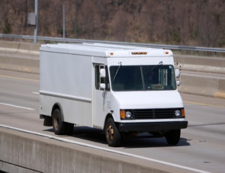 A white panel truck. A white panel truck.