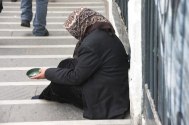 A panhandler on the street. A panhandler on the street.